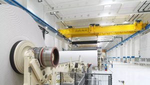 Double girder bridge crane spreader for paper mill