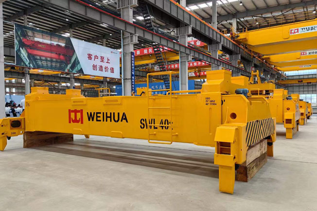 Container crane spreaders for port terminals