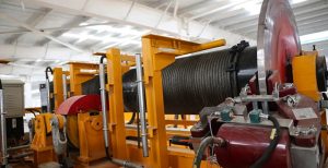 a crane has a cable with a breaking strain
